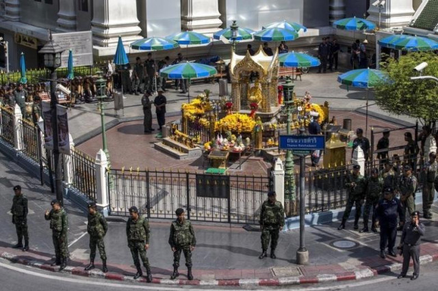 military personnel and police officers stand guard before a crime re enactment near the bomb site at erawan shrine in bangkok thailand september 26 2015 photo reuters military personnel and police officers stand guard before a crime re enactment near the bomb site at erawan shrine in bangkok thailand september 26 2015 photo reuters