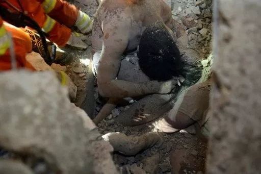 rescuers save three year old wu ningxi who was protected by the body of her dead father more than 12 hours after four buildings collapsed in wenzhou eastern china photo afp rescuers save three year old wu ningxi who was protected by the body of her dead father more than 12 hours after four buildings collapsed in wenzhou eastern china photo afp