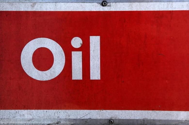the word oil is pictured on an oil bank at a recycling yard in london march 2 2011 photo reuters