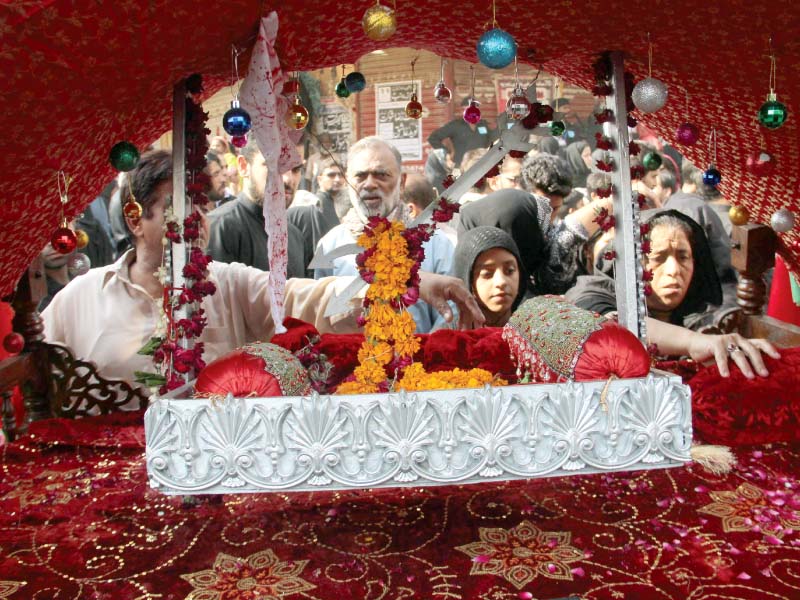 mourners pay respect at a tazia at muharram 9 procession all processions will merge with the main procession on ashura photo express