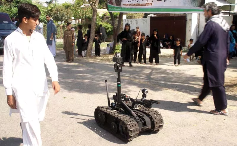 bomb disposal squad personnel use a remotely controlled robotic vehicle to clear the vicinity of g 6 imambargah photo inp bomb disposal squad personnel use a remotely controlled robotic vehicle to clear the vicinity of g 6 imambargah photo inp