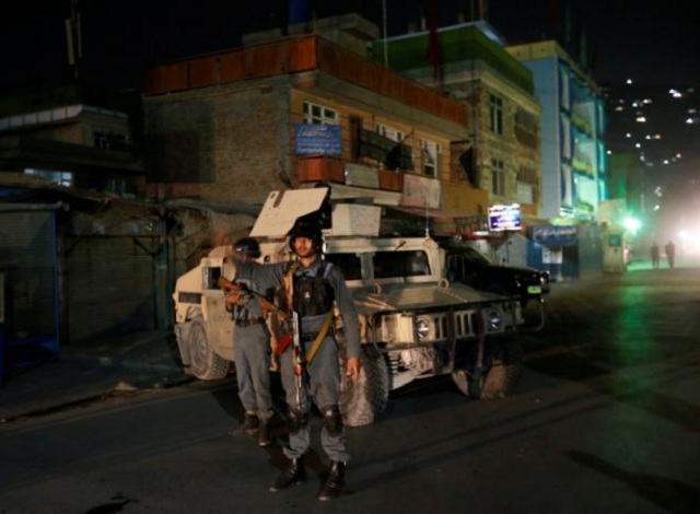 afghan policemen stand guard near the site of an attack in kabul afghanistan photo reuters