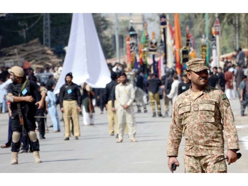 army personnel and law enforcement agencies escort the main procession of 9th muharramul haram on tuesday in peshawar photo muhammad iqbal express