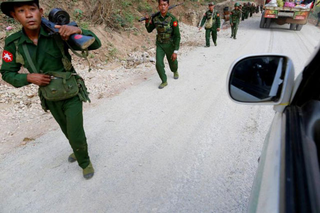 myanmar army soldiers walk along a road near laukkai on february 17 2015 photo reuters