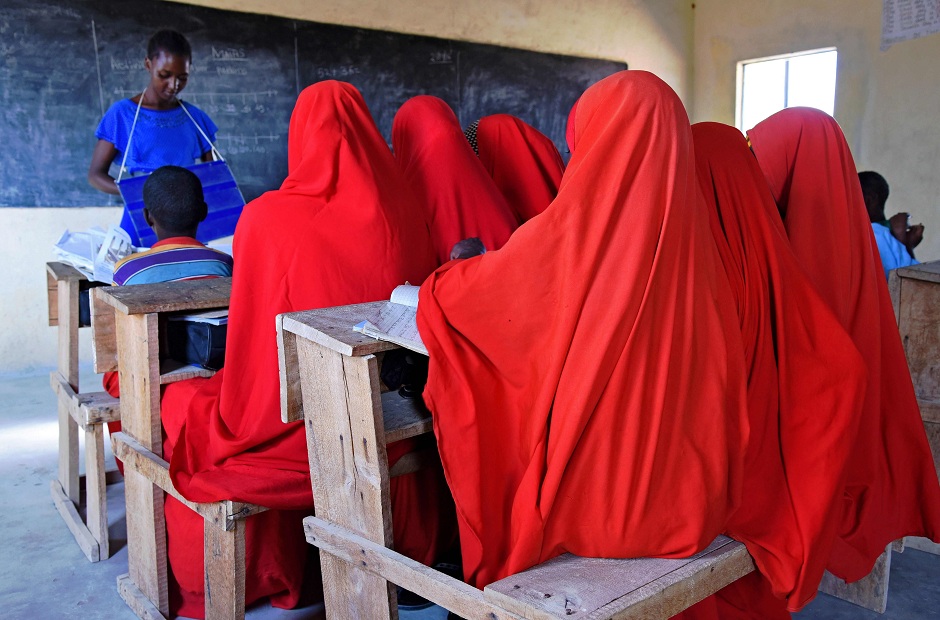 halima who was was married at the age of 13 to a man 12 years her senior sits with fellow pupils during lessons at a school in wajir photo afp
