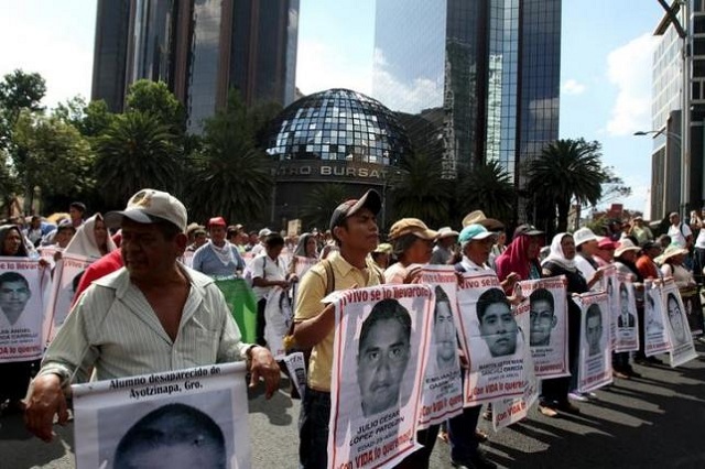 relatives carry photos of some of the 43 missing students of the ayotzinapa teachers 039 training college during a march to mark the ten month anniversary of their disappearance in mexico city mexico july 26 2015 reuters stringer relatives carry photos of some of the 43 missing students of the ayotzinapa teachers 039 training college photo reuters