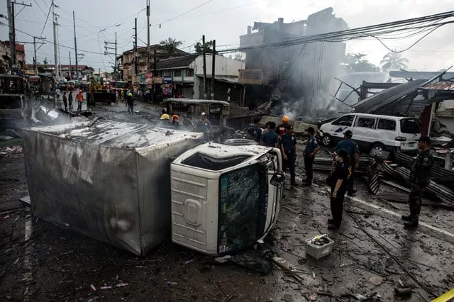 a truck was turned over after an explosion during a fire at fireworks shop in bocaue bulacan north of manila on october 12 2016 photo afp a truck was turned over after an explosion during a fire at fireworks shop in bocaue bulacan north of manila on october 12 2016 photo afp