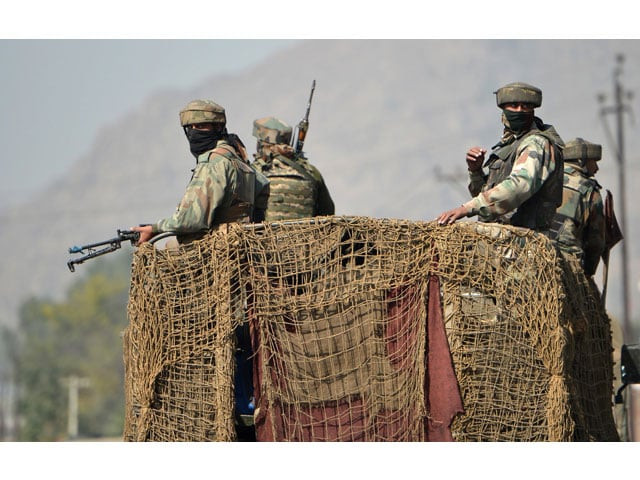 an indian army vehicle drives past a building where suspected militants are thought to be hiding on the third day of a gunfight between the indian army and suspected militants in pampore south of srinagar on october 12 2016 photo afp an indian army vehicle drives past a building where suspected militants are thought to be hiding on the third day of a gunfight between the indian army and suspected militants in pampore south of srinagar on october 12 2016 photo afp