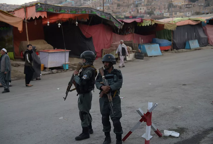 afghan policemen stand guard at the main gate of the karte sakhi shrine in kabul on october 12 2016 photo afp afghan policemen stand guard at the main gate of the karte sakhi shrine in kabul on october 12 2016 photo afp