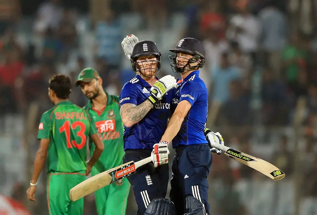 chris woakes r and ben stokes celebrate after winning the third odi in chittagong on october 12 2016 photo afp