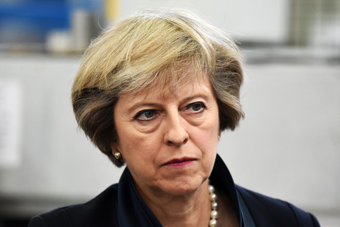 british prime minister theresa may looks on during a visit to the warwick manufacturing group facility at the university of warwick on september 1 2016 in solihull england photo afp