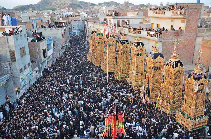 mourners carry tazias at the ashura procession in chiniot photo online