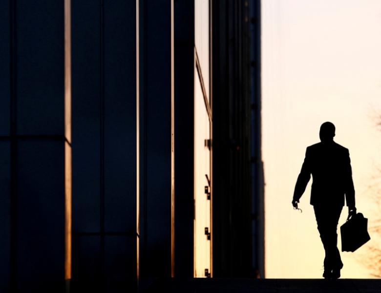 a worker arrives at his office in the canary wharf business district in london photo reuters