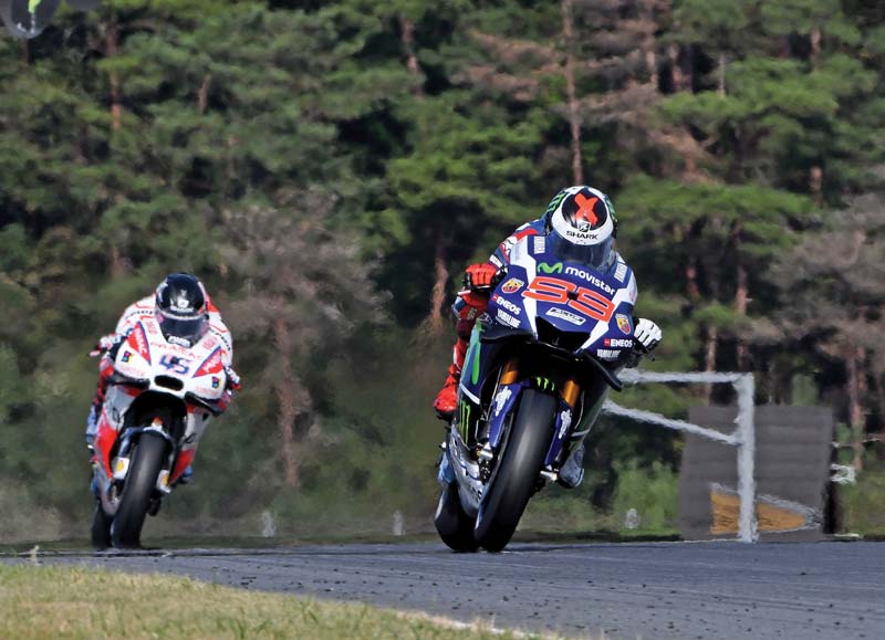 lorenzo clocked 1min 45 151sec followed by ducati s andrea dovizioso who lapped 0 053sec slower with rising suzuki star maverick vinales third photo afp