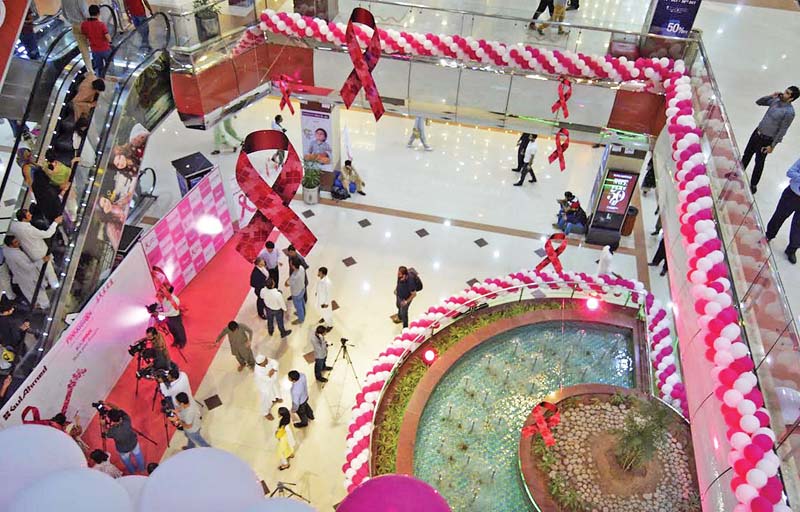 pink ribbons and balloons are displayed at centaurus mall to mark the breast cancer month photo online