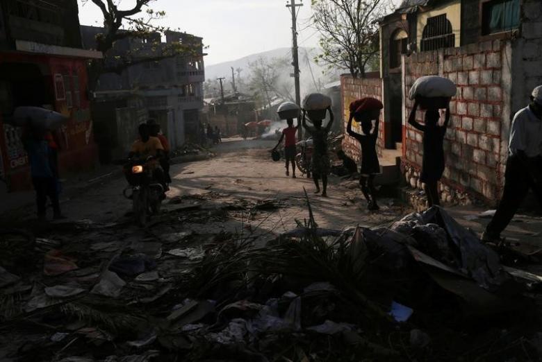 a view of traffic and people walking along a street after hurricane matthew hit jeremie haiti photo reuters