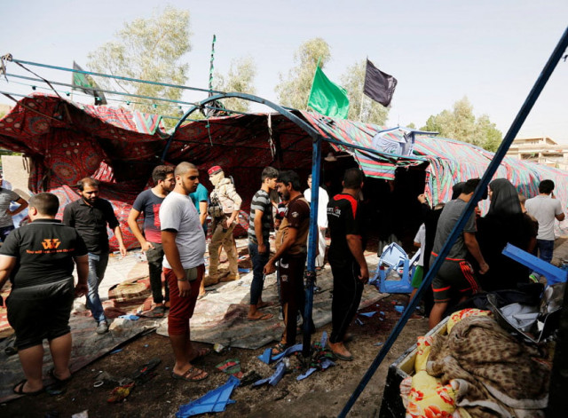 people gather at the site of a suicide bomb attack in the city 039 s northern al shaab district in baghdad iraq october 15 2016 photo reuters