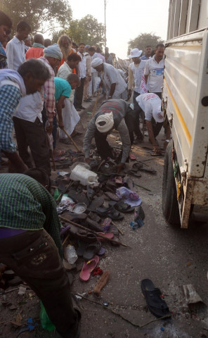 indian bystanders gather near the scene of a stampede in varanasi on october 15 2016 photo afp indian bystanders gather near the scene of a stampede in varanasi on october 15 2016 photo afp