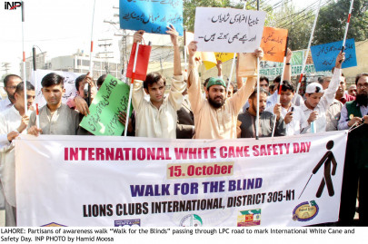 awareness walk held in rawalpindi to mark white cane day