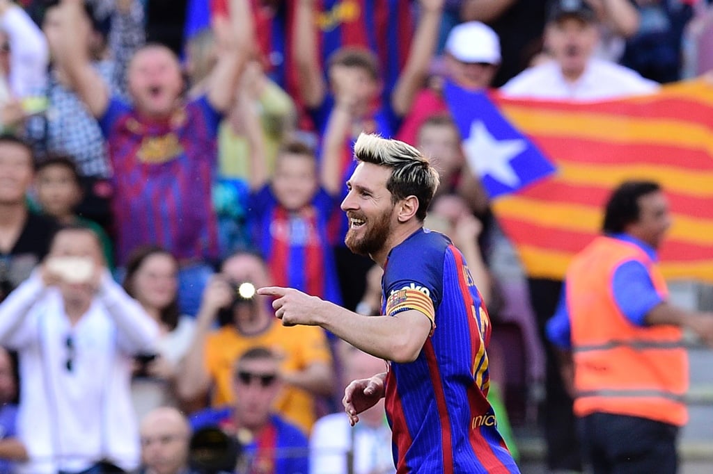 lionel messi celebrates after scoring at camp nou stadium in barcelona on october 15 2016 photo afp