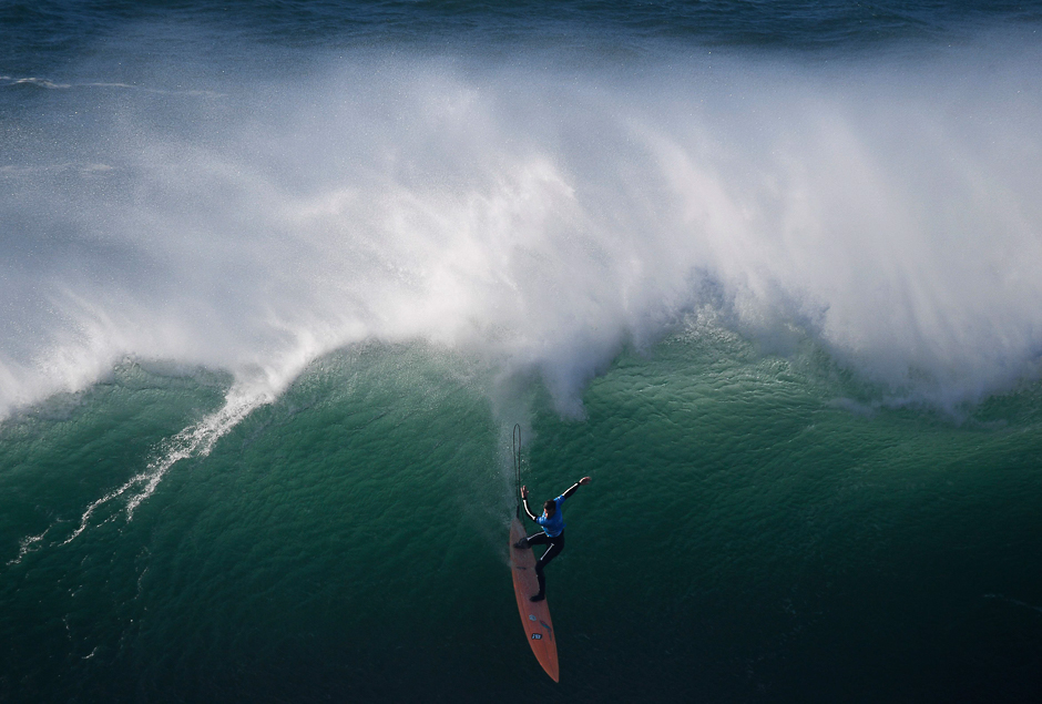 American big wave surfer Nic Lamb drops a wave off Praia do Norte in Nazare during the first edition of the World Surf League's Nazare Challenge. PHOTO: AFP