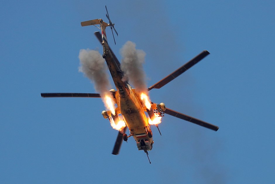 an iraqi airforce helicopter fires missiles at islamic state fighters at the outskirts of mosul iraq photo reuters