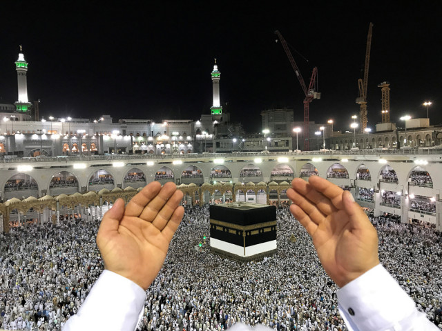 a pilgrim prays in front of the holy kaaba ahead of the haj photo reuters a pilgrim prays in front of the holy kaaba ahead of the haj photo reuters