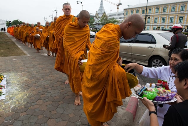 thousands of thai men and women gather daily in the vicinity of the palace to pray for the late thai king bhumibol adulyadej after his recent passing photo afp