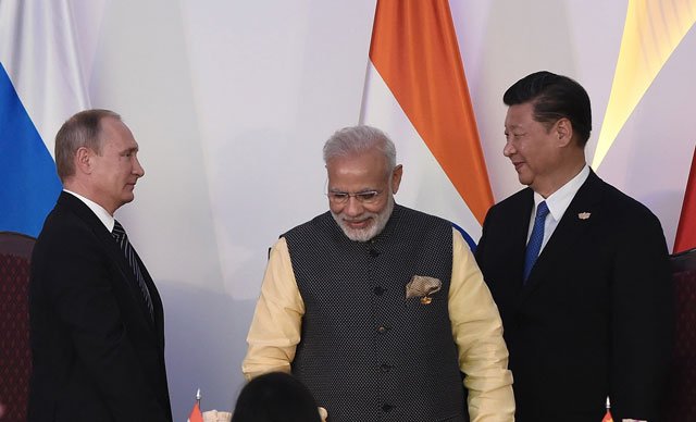 russia 039 s president vladimir putin l india prime minister narendra modi c and china 039 s president xi jingping prepare to leave at the concluding session of the brics summit at taj exotica hotel in goa on october 16 2016 photo afp