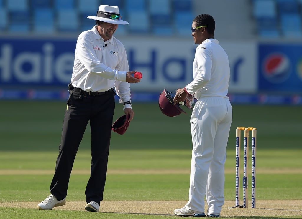 field umpire richard illingworth l gives the pink ball before the start of second ever day night test match photo afp