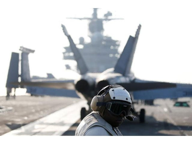a us navy crew member looks at a f a 18 super hornet fighter as it prepares for take off from the uss ronald reagan a nimitz class nuclear powered super carrier during a joint naval drill between south korea and the us in the west sea south korea october 14 2016 photo reuters a us navy crew member looks at a f a 18 super hornet fighter as it prepares for take off from the uss ronald reagan a nimitz class nuclear powered super carrier during a joint naval drill between south korea and the us in the west sea south korea october 14 2016 photo reuters