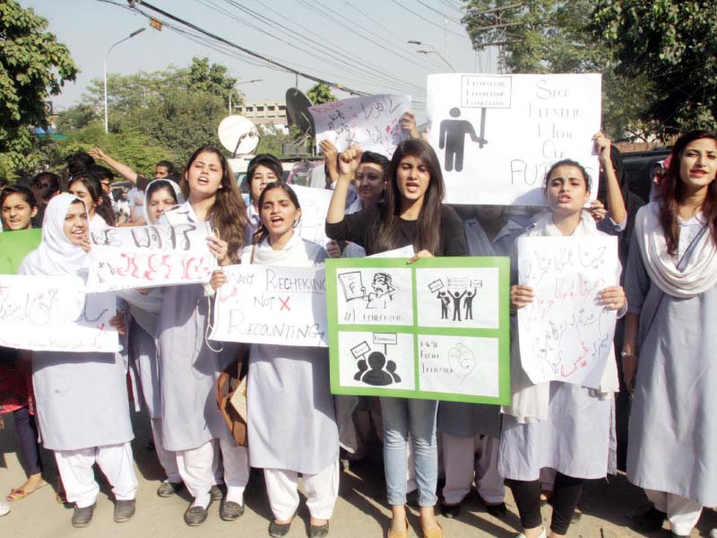 students protest outside the press club demanding rechecking of papers photo abid nawaz