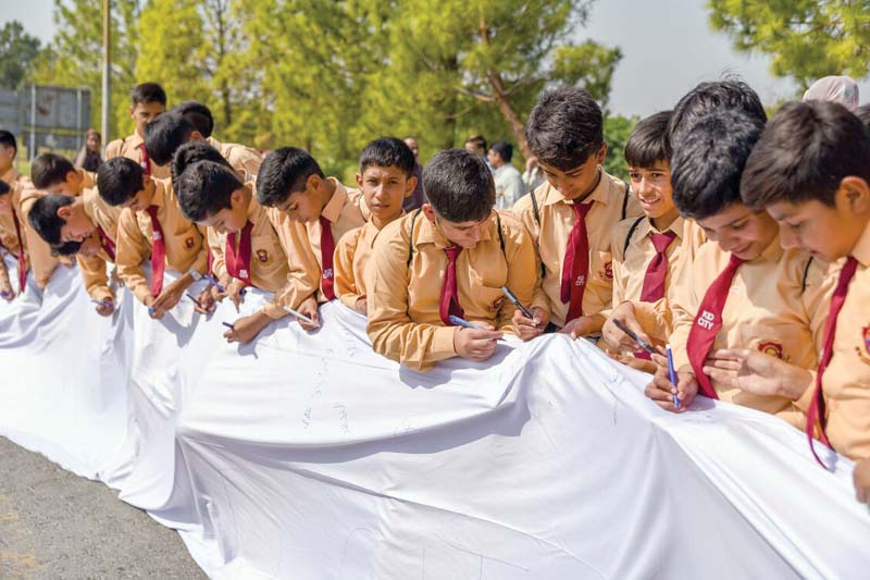 students sign 2km long flag with peace messages in islamabad