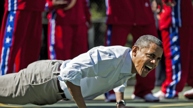 us president barack obama does pushups during backetball shooting drills during the annual easter egg roll on the south lawn of the white house april 9 2012 in washington dc the first family participated in the yearly event where the south lawn is opened up to guests to participate in various egg rolls and other activities photo afp