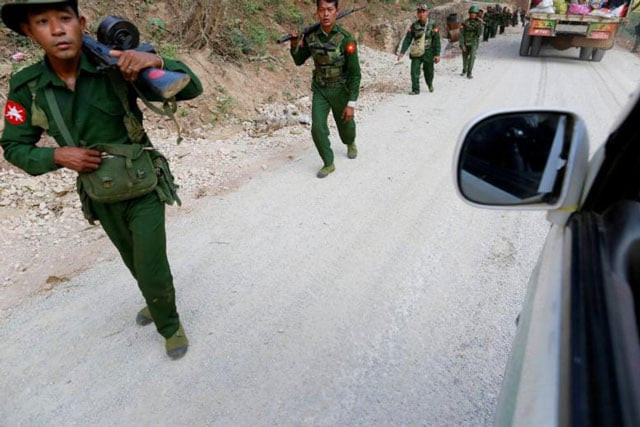 myanmar army soldiers walk along a road near laukkai on february 17 2015 photo reuters myanmar army soldiers walk along a road near laukkai on february 17 2015 photo reuters