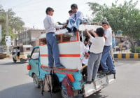 a number of school children travel in a van hyderabad parents of certain students in karachi approached the court against what they saw as an unjustified increase in school fee photo online