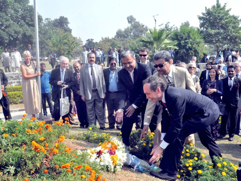 argentine ambassador ivan ivanissevich and islamabad mayor anser aziz lay flowers at argentina park photo express