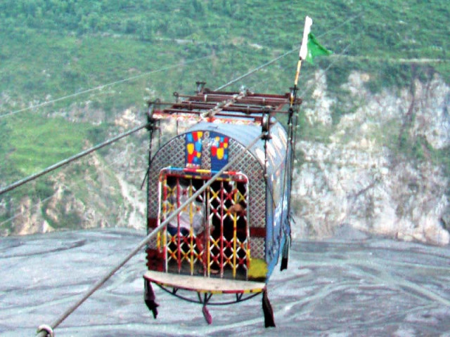 a cable car rolls thousands of feet above the daur river photo express