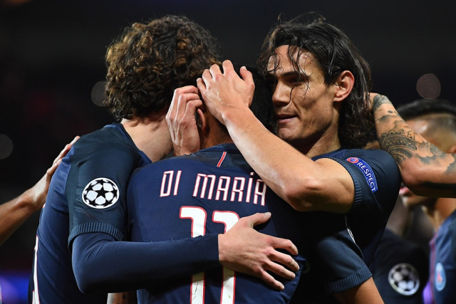 angel di maria c celebrates with edinson cavani r and adrien rabiot l at the parc des princes stadium in paris on october 19 2016 photo afp