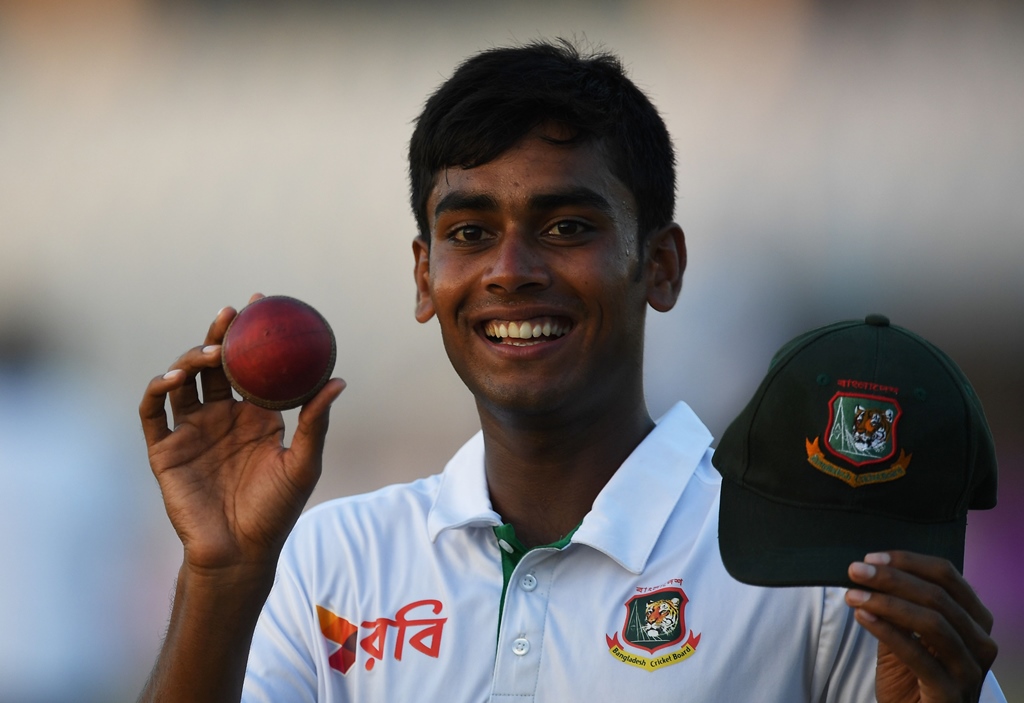 mehedi hasan poses with the match ball and cap after his five wicket haul in chittagong on october 20 2016 photo afp