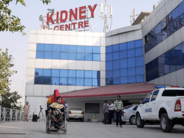 a woman takes a patient from kidney centre as police sealed the health facility on jhelum road photo waseem nazir express a woman takes a patient from kidney centre as police sealed the health facility on jhelum road photo waseem nazir express