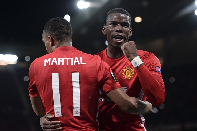 manchester united 039 s french striker anthony martial l embraces manchester united 039 s french midfielder paul pogba r as he celebrates scoring their second goal from the penalty spot during the uefa europa league group a football match between manchester united and fenerbahce at old trafford in manchester north west england on october 20 2016 photo afp