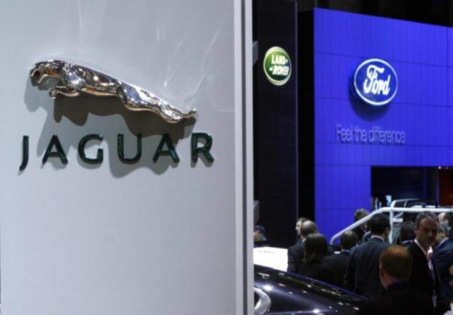 file photograph   logos of the carmakers jaguar land rover and ford are pictured during the first media day of the 78th geneva car show at the palexpo in geneva march 4 2008 photo reuters