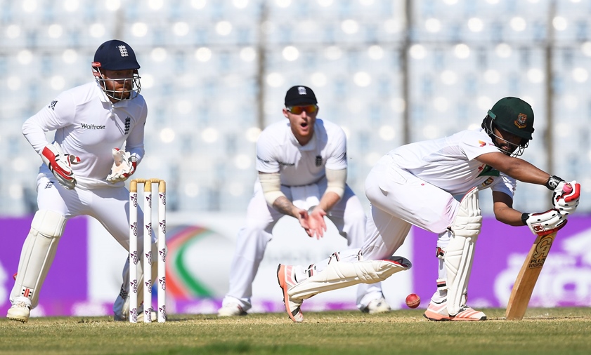 bangladesh 039 s tamim iqbal r watched by england 039 s wicketkeeper jonny bairstow plays a shot during the second day 039 s play of the first test cricket match between bangladesh and england at zahur ahmed chowdhury cricket stadium in chittagong on october 21 2016 photo afp