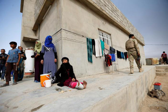 civilians are seen after the liberation of khalidiya village from islamic state militants south of mosul during an operation to attack islamic state militants in mosul iraq october 20 2016 photo reuters