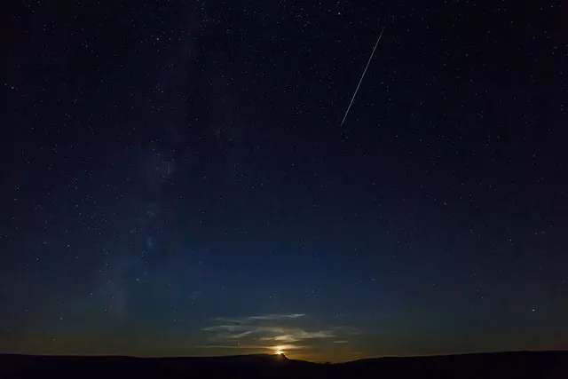 this picture shows a perseid meteor along the milky way illuminating the dark sky near pesquera de ebro in the province of burgos northern spain during the 039 perseids 039 meteor shower photo afp this picture shows a perseid meteor along the milky way illuminating the dark sky near pesquera de ebro in the province of burgos northern spain during the 039 perseids 039 meteor shower photo afp