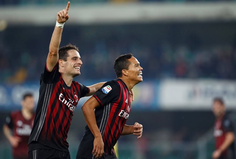 ac milan 039 s carlos bacca r celebrates with his team mate giacomo bonaventura l after chievo 039 s dario dainelli scored an own goal photo reuters