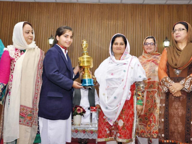 abbottabad edo faiza shafi presents a trophy to the declamation contest winner bushra azim photo express abbottabad edo faiza shafi presents a trophy to the declamation contest winner bushra azim photo express