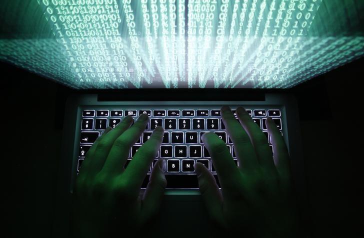 a man types on a computer keyboard in warsaw in this february 28 2013 illustration file picture photo reuters