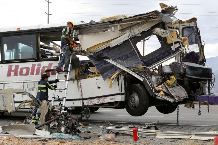 workers cut away debris from the front of a bus involved in a mass casualty crash on the westbound interstate 10 freeway near palm springs california october 23 2016 photo reuters